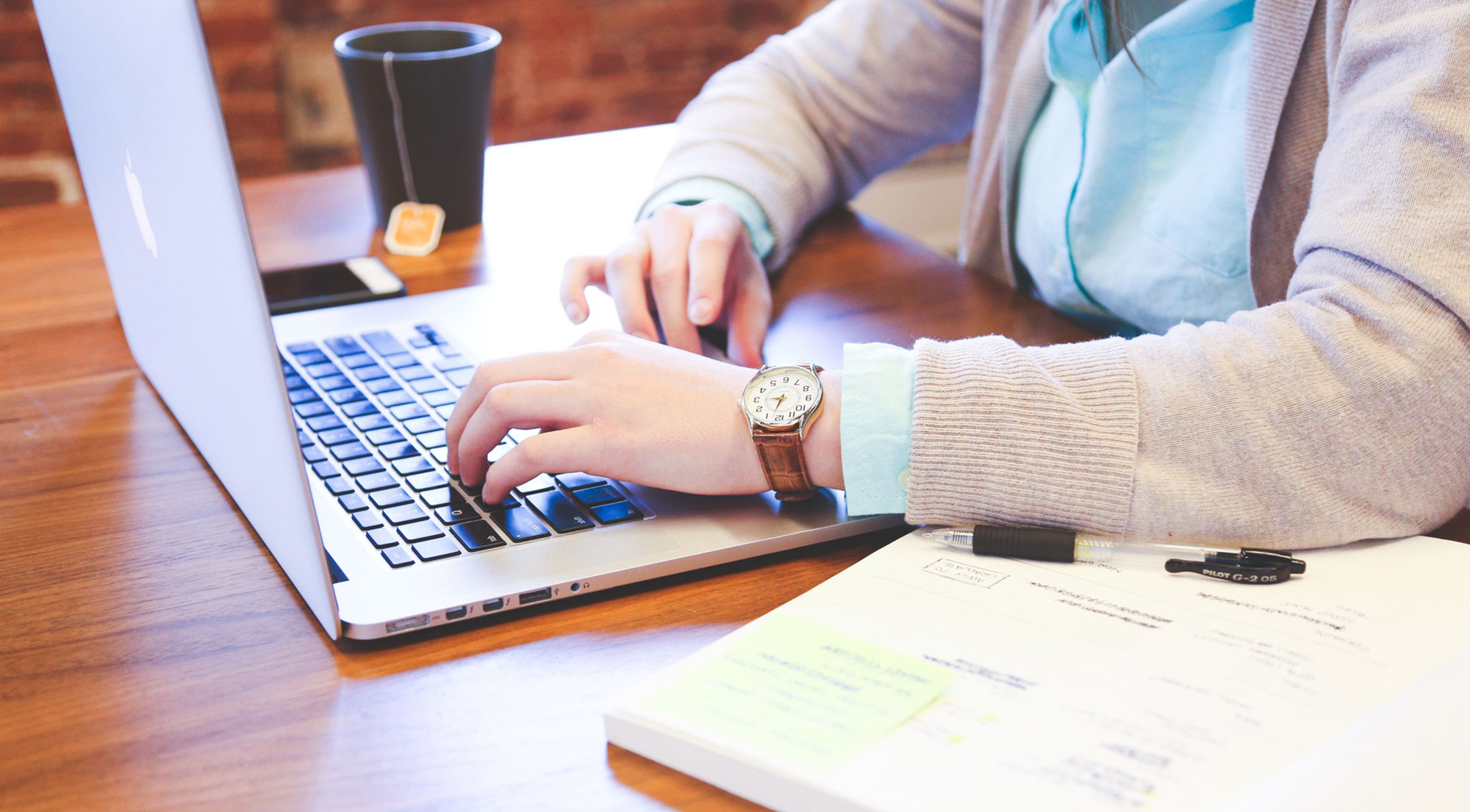 woman typing on laptop