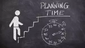 chalking drawing of person walking up stairs for planning time and stopwatch