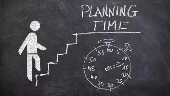 chalking drawing of person walking up stairs for planning time and stopwatch