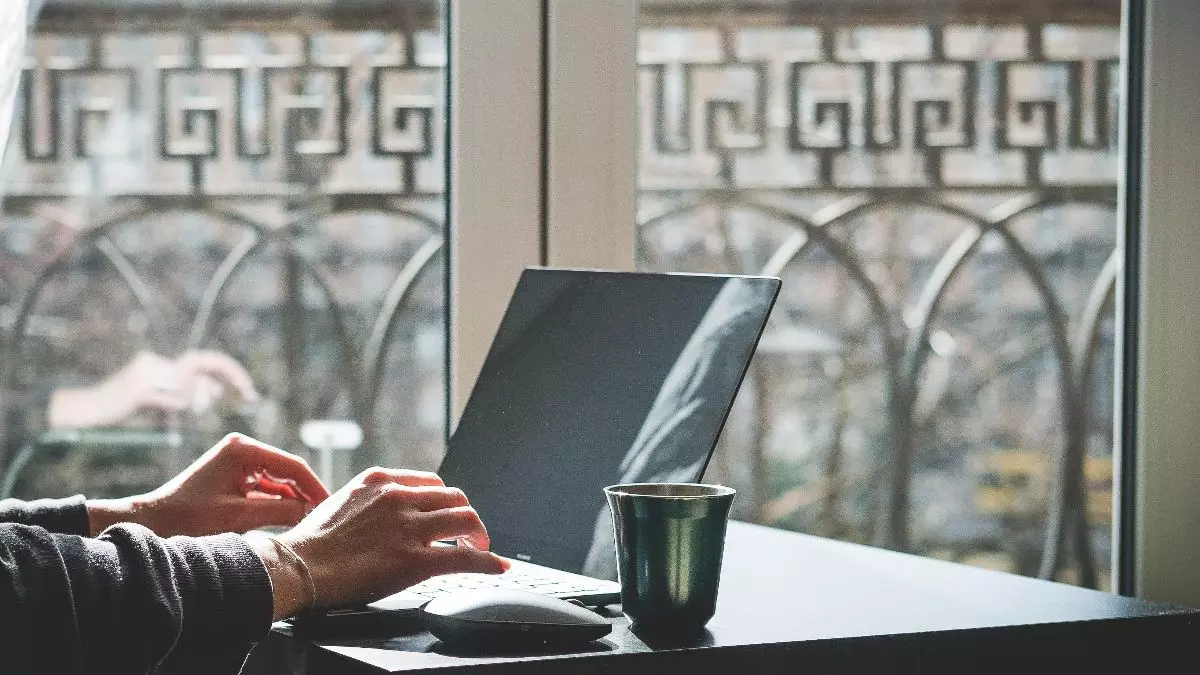 person typing on laptop