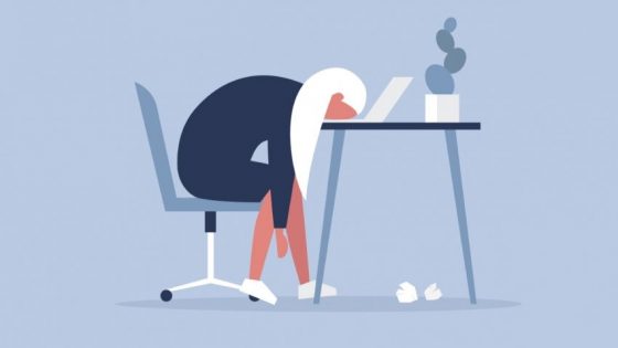 graphic of woman sitting at desk with head on table