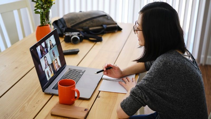 woman on video call with laptop